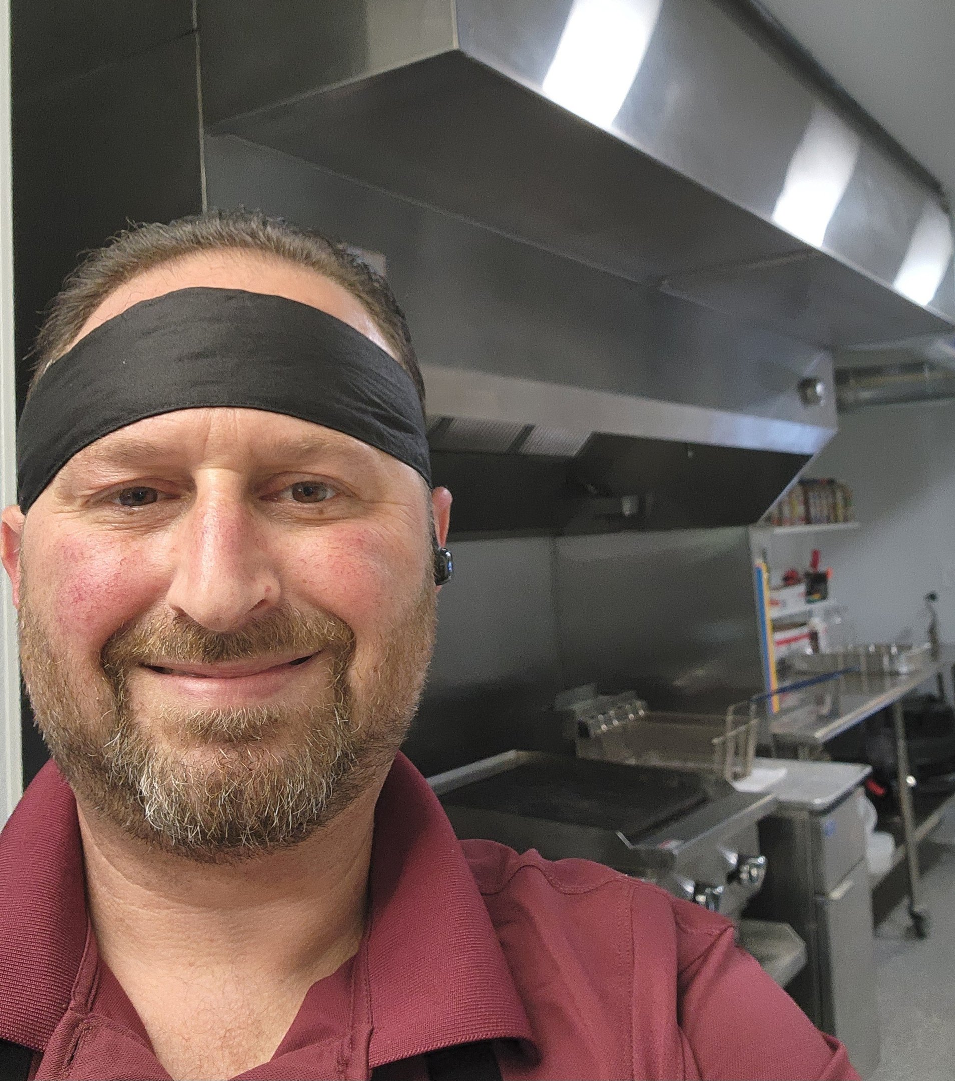 Chef Joseph Goldman smiling in a professional kitchen